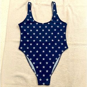 NWOT one piece, low back, sexy bathing suit. Fits like a medium